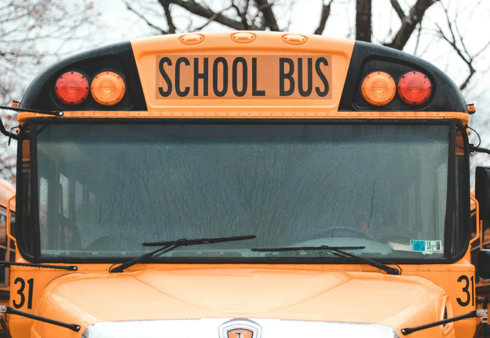 The front of a yellow school bus